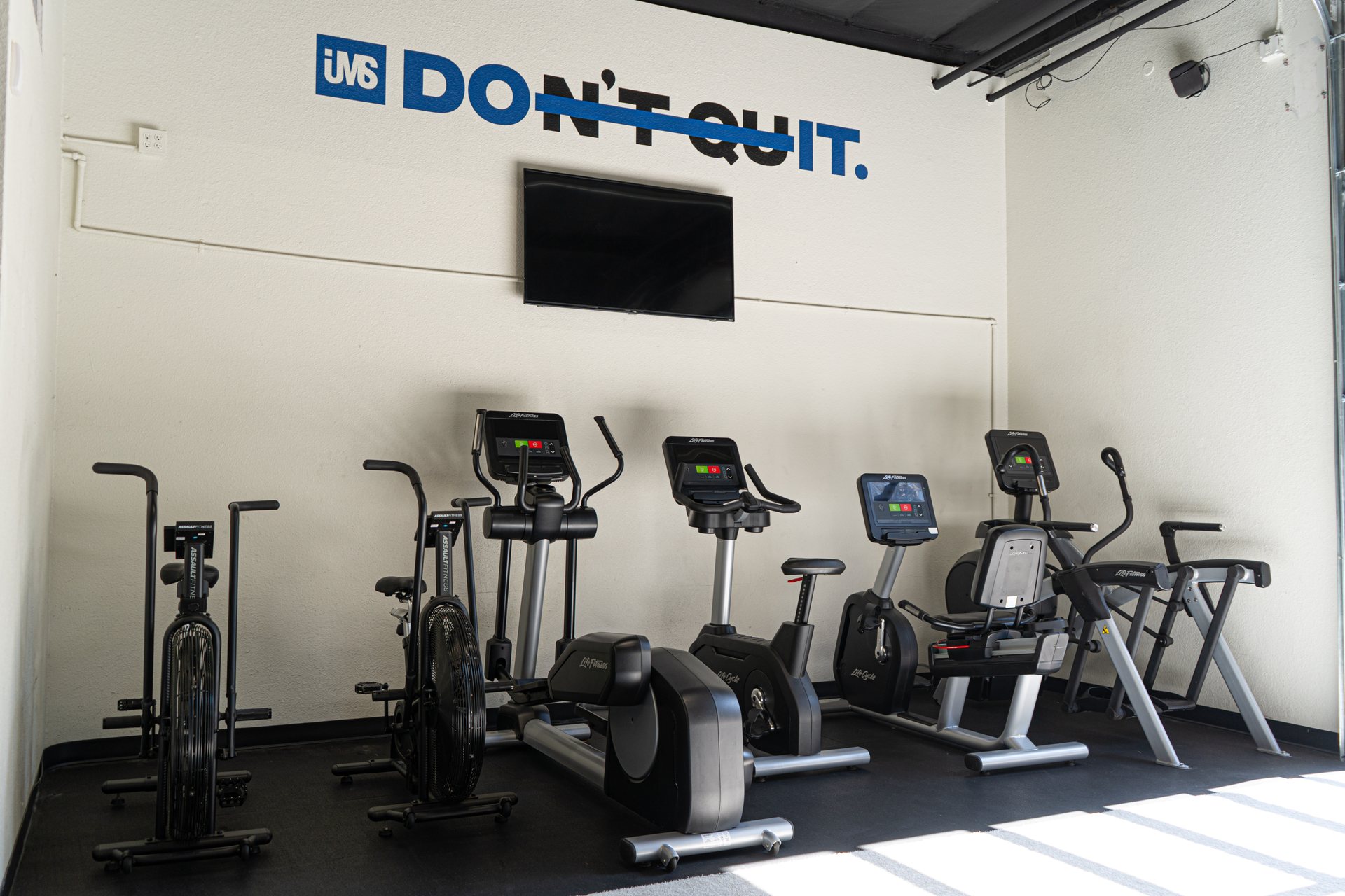 Conditioning equipment beneath the Don't Quit wall at IMS